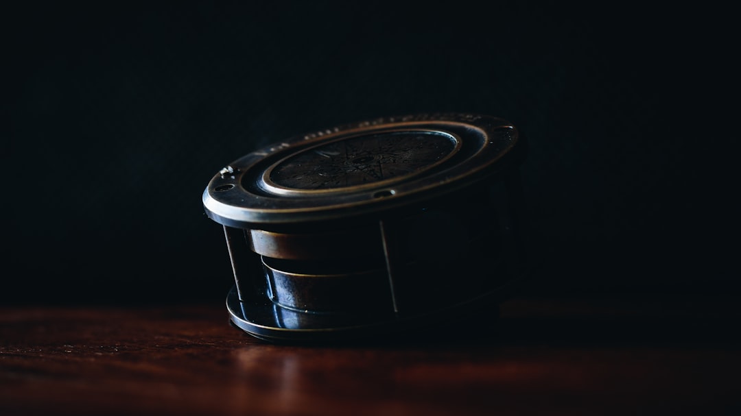 A detailed close-up shot of a high-quality fly fishing reel, highlighting the intricate mechanics and design of the equipment that needs protection.